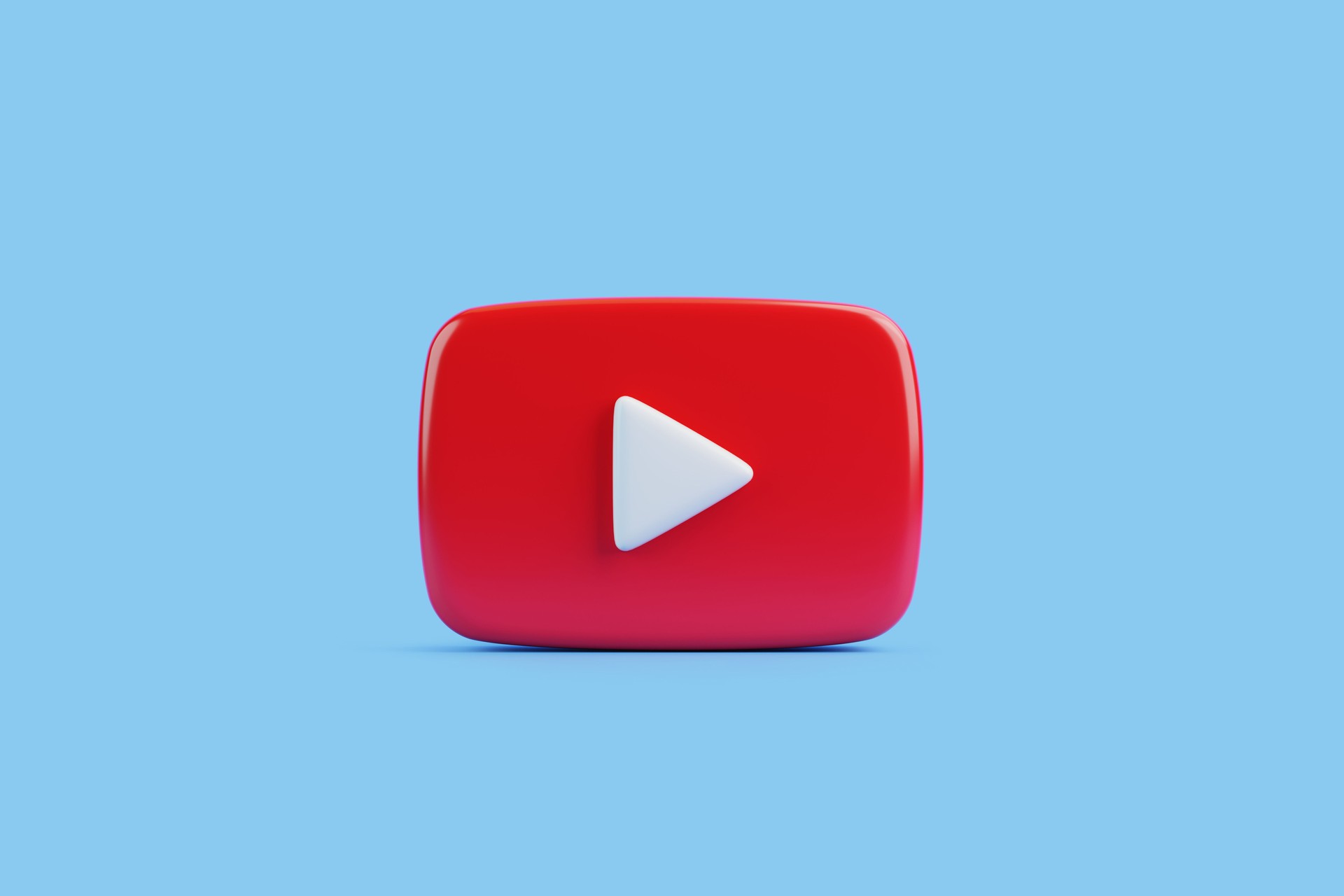 Red play button icon on blue background